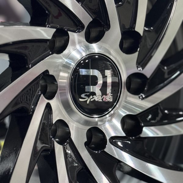 Rines r15x6.5 4x100 4x114.3 10702 R1 Black Machine Face - Imagen 5
